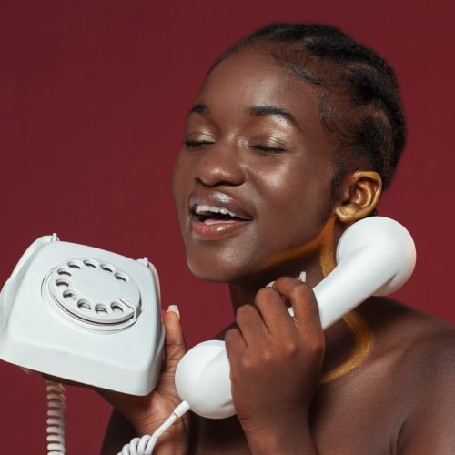 side-view-woman-holding-telephone